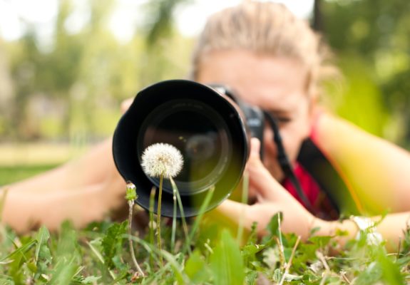 10686818-photographer-girl-making-pictures-of-flower-in-nature 10686818-photographer-girl-making-pictures-of-flower-in-nature